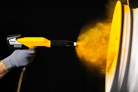 Electrostatic powder coating of a wheel using Gema OptiFlex ProX powder coating gun, demonstrating precise powder application, high transfer efficiency and consistent industrial coating quality.