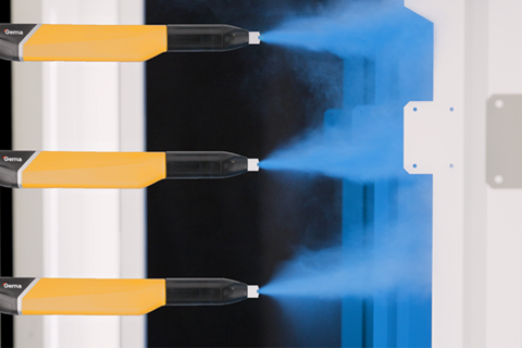 Automatic powder gun spraying blue powder on a part